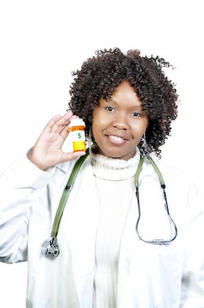 dollar sign of pills - An doctor holding a bottle of prescription medication Stock Photo - Budget Royalty-Free & Subscription, Code: 400-05270216