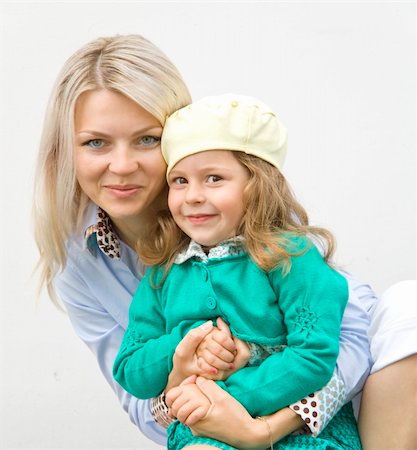 fastof (artist) - Happy mum and daughter embrace on the white Stock Photo - Budget Royalty-Free & Subscription, Code: 400-05270834