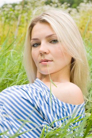 fastof (artist) - The woman lays in a grass with the bared shoulder and holds a grass in lips Stock Photo - Budget Royalty-Free & Subscription, Code: 400-05270833