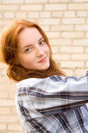 fastof (artist) - The red girl in a shirt clambers on a metal ladder and playfully looks in a distance Stock Photo - Budget Royalty-Free & Subscription, Code: 400-05270845