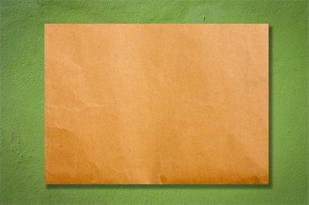 simsearch:400-04605657,k - Brown paper on green cement wall Stockbilder - Microstock & Abonnement, Bildnummer: 400-05271681