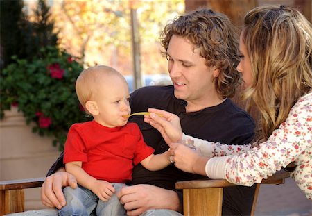 Happy mother and father feeding child Stock Photo - Budget Royalty-Free & Subscription, Code: 400-05271748