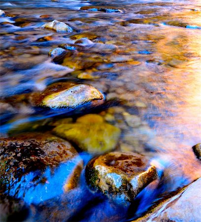 A river flows perfectly over the rocky riverbed at sunrise. Stock Photo - Budget Royalty-Free & Subscription, Code: 400-05272065