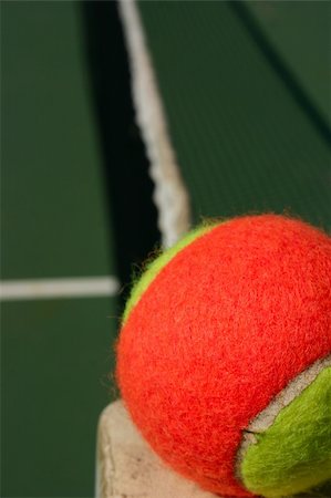 Yellow-red balls on a green tennis court Stock Photo - Budget Royalty-Free & Subscription, Code: 400-05272528