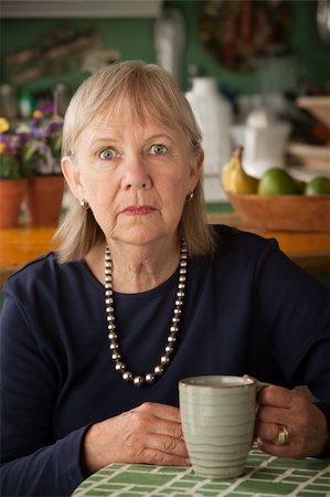 simsearch:400-04744719,k - Depressed senior woman at home with coffee or tea Stock Photo - Budget Royalty-Free & Subscription, Code: 400-05272786