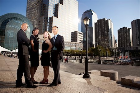 A successful business team in an outdoor setting against a city background Stock Photo - Budget Royalty-Free & Subscription, Code: 400-05272923
