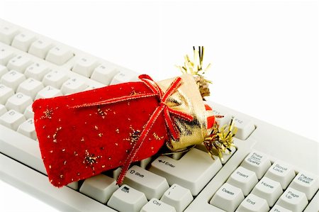 simsearch:400-04698351,k - christmas gift with pc keyboard isolated on white background Stock Photo - Budget Royalty-Free & Subscription, Code: 400-05273094