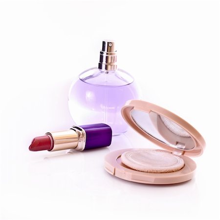 serezniy (artist) - Lipstick, powder and perfume isolated on white Stockbilder - Microstock & Abonnement, Bildnummer: 400-05273248