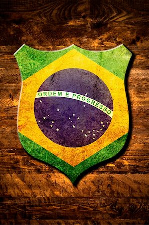 simsearch:400-08034320,k - A metal Brazil shield on a wooden background Stock Photo - Budget Royalty-Free & Subscription, Code: 400-05273720