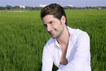 Young man outdoor happy relaxed on green rice field meadow Stock Photo - Budget Royalty-Free & Subscription, Code: 400-05273746