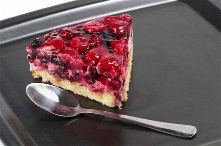 simsearch:400-06365777,k - Small berries tart piece macro shot over black plate Stock Photo - Budget Royalty-Free & Subscription, Code: 400-05284073