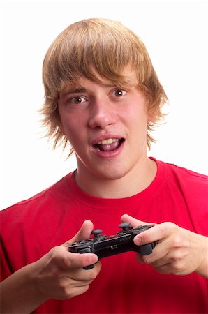 simsearch:400-05059261,k - Young teenage boy gamer with gamepad in the hands isolated over white background Stock Photo - Budget Royalty-Free & Subscription, Code: 400-05284081