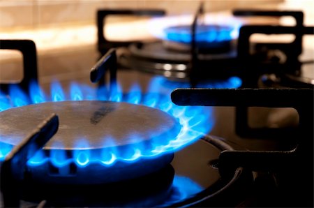 dangerous kitchen - Black gas stove and two burning flames close-up Stock Photo - Budget Royalty-Free & Subscription, Code: 400-05284092