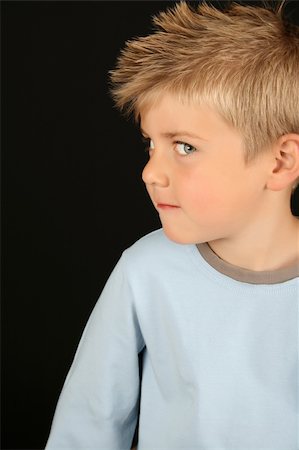 peeping fashion - Cute blond boy on a black background Stock Photo - Budget Royalty-Free & Subscription, Code: 400-05284224