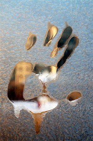 frost on windows - freezing glass with a print of a hand Stock Photo - Budget Royalty-Free & Subscription, Code: 400-05284339