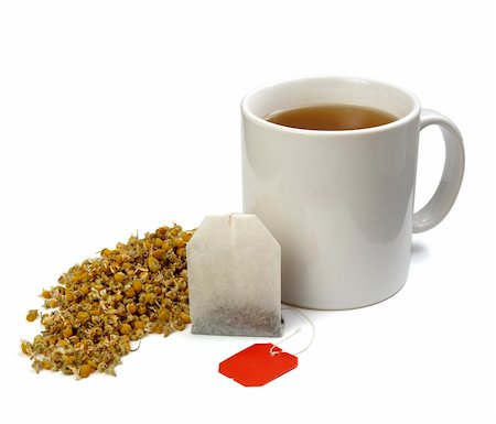 simsearch:400-06554630,k - close up of tea bag, chamomile plant  and coffee cup on white background with clipping path, shadow is not included Stock Photo - Budget Royalty-Free & Subscription, Code: 400-05284375