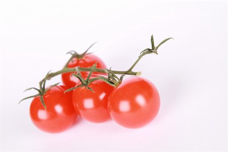 simsearch:400-06101333,k - Red cherry tomatoes on a white background. Stock Photo - Budget Royalty-Free & Subscription, Code: 400-05284607