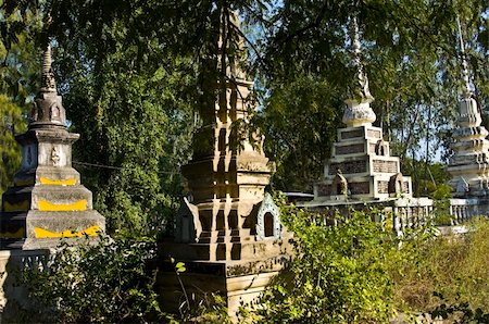 beautiful old colorful chedis on a a thai cemetery Stock Photo - Budget Royalty-Free & Subscription, Code: 400-05284719