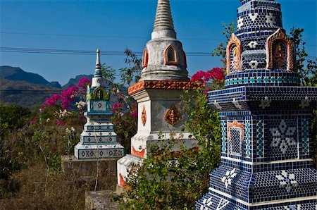 beautiful old colorful chedis on a a thai cemetery Stock Photo - Budget Royalty-Free & Subscription, Code: 400-05284720