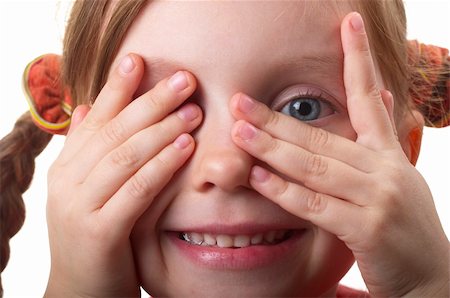 Little girl peeping through hand with one eye isolated over white background Fotografie stock - Microstock e Abbonamento, Codice: 400-05284907
