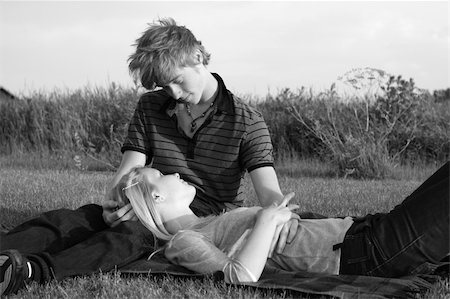 Young teenage couple in love cuddling on a blanket Stock Photo - Budget Royalty-Free & Subscription, Code: 400-05285245