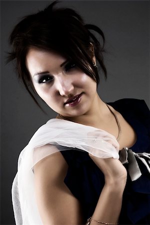 simsearch:400-04267059,k - Portrait of a young beautiful brunette holding her sheer scarf Photographie de stock - Aubaine LD & Abonnement, Code: 400-05285485