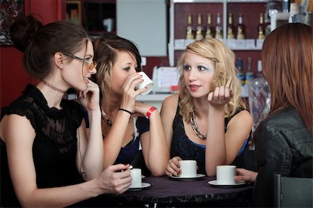 simsearch:400-04238163,k - Four young ladies with coffee in a cafe Stock Photo - Budget Royalty-Free & Subscription, Code: 400-05285707