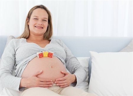 simsearch:400-04176771,k - Happy future mom having cubes on her belly sitting on a bed Stock Photo - Budget Royalty-Free & Subscription, Code: 400-05286021