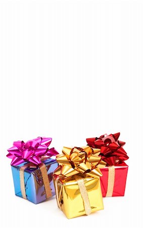 simsearch:400-03975392,k - Three colorful gift boxes with bows for Christmas or Valentines Day isolated on white background with copy space Foto de stock - Royalty-Free Super Valor e Assinatura, Número: 400-05286061