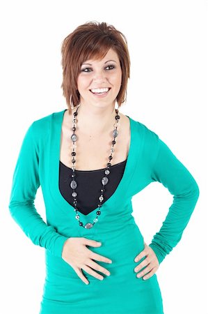 Cute young adult caucasian woman wearing a Turquoise dress and a beaded necklace with short brunette hair on a white background. Not Isolated Stock Photo - Budget Royalty-Free & Subscription, Code: 400-05286251