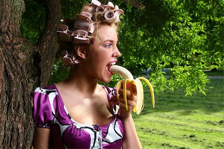 a beautiful young woman eating banan Stock Photo - Budget Royalty-Free & Subscription, Code: 400-05286494