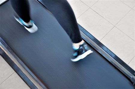 fuzzbones (artist) - Girl's feet close-up when running on a treadmill Stock Photo - Budget Royalty-Free & Subscription, Code: 400-05286630