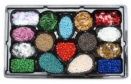 simsearch:400-05021263,k - Colour beads in form under sweetmeats on white background Foto de stock - Super Valor sin royalties y Suscripción, Código: 400-05286718