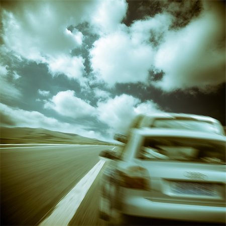 fast car close up - the car running on the road.with the cloudy sky background. Stock Photo - Budget Royalty-Free & Subscription, Code: 400-05287014