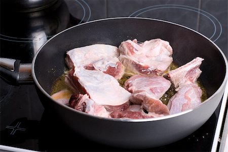 Beef sliced meat cooking in frying pan Stock Photo - Budget Royalty-Free & Subscription, Code: 400-05287294