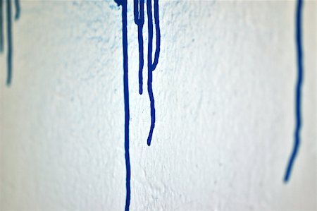 simsearch:400-05041332,k - White wall with blue dripping paint. Selective focus. Photographie de stock - Aubaine LD & Abonnement, Code: 400-05287924