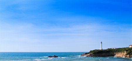 white lighthouse, blue sky, beacon Stock Photo - Budget Royalty-Free & Subscription, Code: 400-05288026