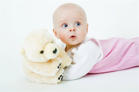 beautiful baby with a bear in the studio Stock Photo - Budget Royalty-Free & Subscription, Code: 400-05288429