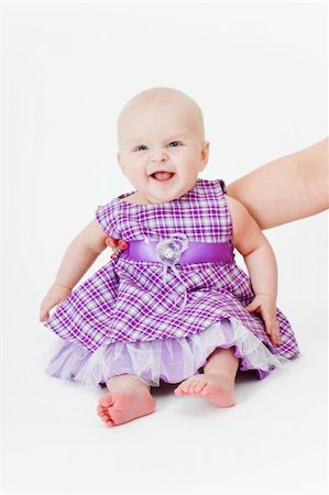 simsearch:400-04140663,k - happy baby sitting on a white background Photographie de stock - Aubaine LD & Abonnement, Code: 400-05288430