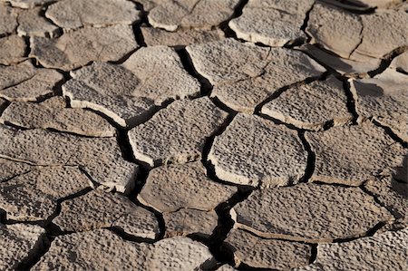 simsearch:400-05247506,k - Cracked by the heat long lifeless soil Stock Photo - Budget Royalty-Free & Subscription, Code: 400-05288579