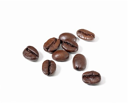 nine roasted coffee beans on white surface Stock Photo - Budget Royalty-Free & Subscription, Code: 400-05280449