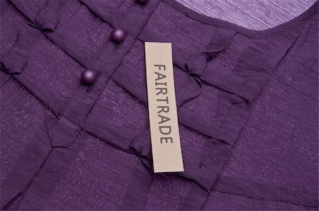 Fair Trade Clothing Concept Image with Purple Shirt Detail. Foto de stock - Super Valor sin royalties y Suscripción, Código: 400-05280669