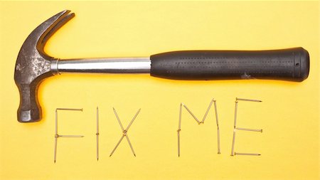 Fix Me Written in Nails with a Hammer. Stock Photo - Budget Royalty-Free & Subscription, Code: 400-05280856