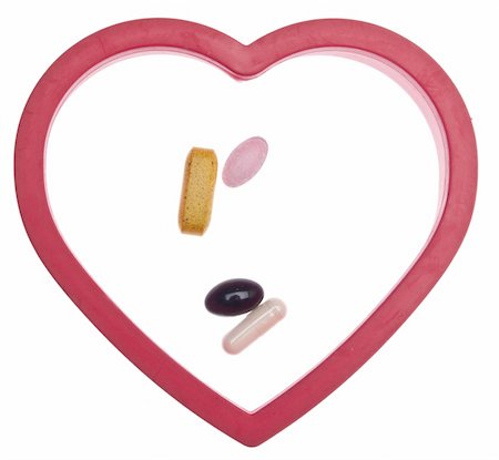 Vitamins and Pills Inside a Heart for a Heart Health Concept Image.  Isolated on White with a Clipping Path. Stock Photo - Budget Royalty-Free & Subscription, Code: 400-05280895