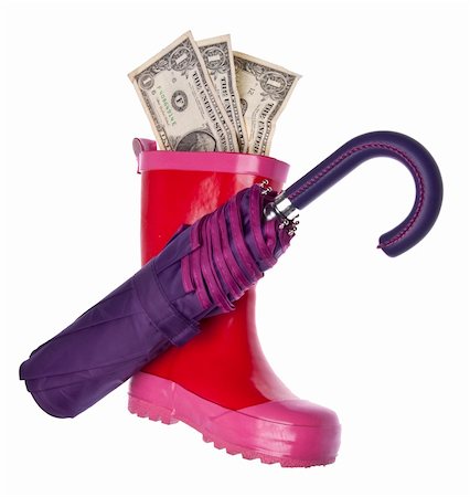 Save Money for a Rainy Day! Purple umbrella, and pink rain boot with American currency isolated on white with a clipping path. Stock Photo - Budget Royalty-Free & Subscription, Code: 400-05280911