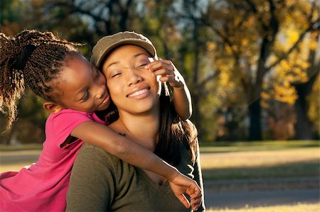 Happy African American mother and child having fun spending time together in a park Photographie de stock - Aubaine LD & Abonnement, Code: 400-05281305