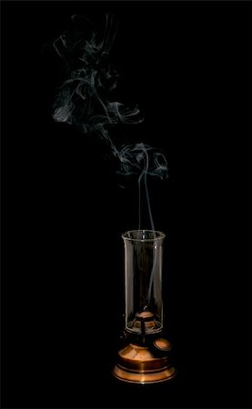 extinct oil lamp and smoke isolated on black Fotografie stock - Microstock e Abbonamento, Codice: 400-05281333