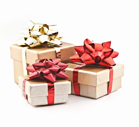 On a white background golden gift box with red ribbon and gold braid. Fotografie stock - Microstock e Abbonamento, Codice: 400-05281554