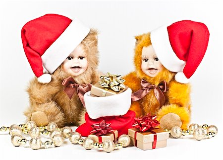 simsearch:400-07123692,k - On a white background are two porcelain bears a Christmas gift bag and a golden ball strings. Stock Photo - Budget Royalty-Free & Subscription, Code: 400-05281558