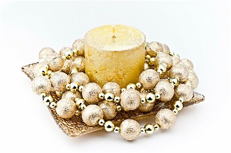 simsearch:400-05326817,k - Isolated on white background gold candle in a glass dish with a decorative string of bombs. Stock Photo - Budget Royalty-Free & Subscription, Code: 400-05281564